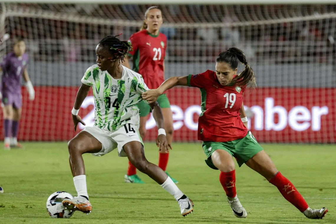 Morocco forward Sakina Ouzraoui trying to dispossess Nigeria defender Oluwatosin Demehin in the Women's Africa Cup of Nations final at Prince Moulay Abdellah Stadium in Rabat on July 26, 2025.