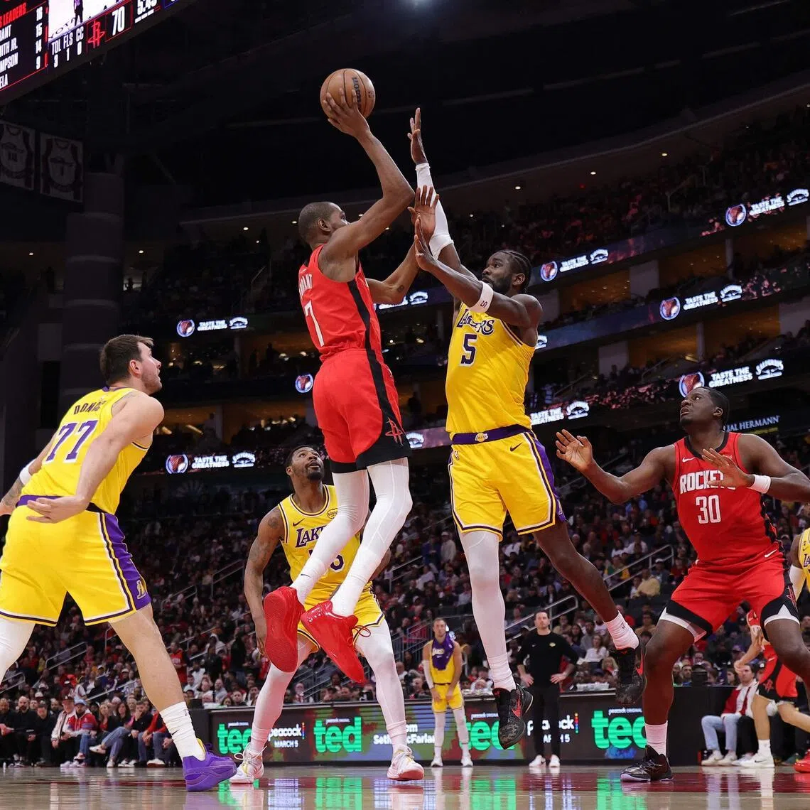 Kevin Durant of the Houston Rockets shoots the ball against Deandre Ayton of the Los Angeles Lakers during the second half at Toyota Center on March 16.