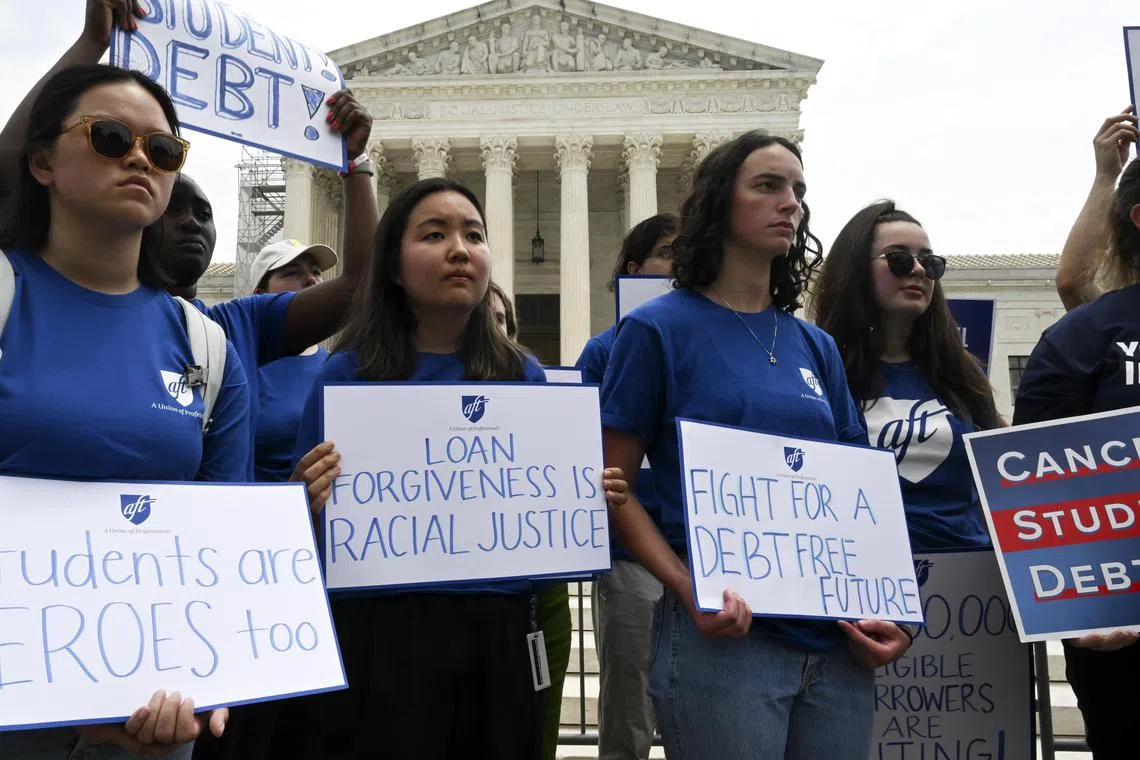 Demonstrators in favour of cancelling student debt protest outside the US Supreme Court.