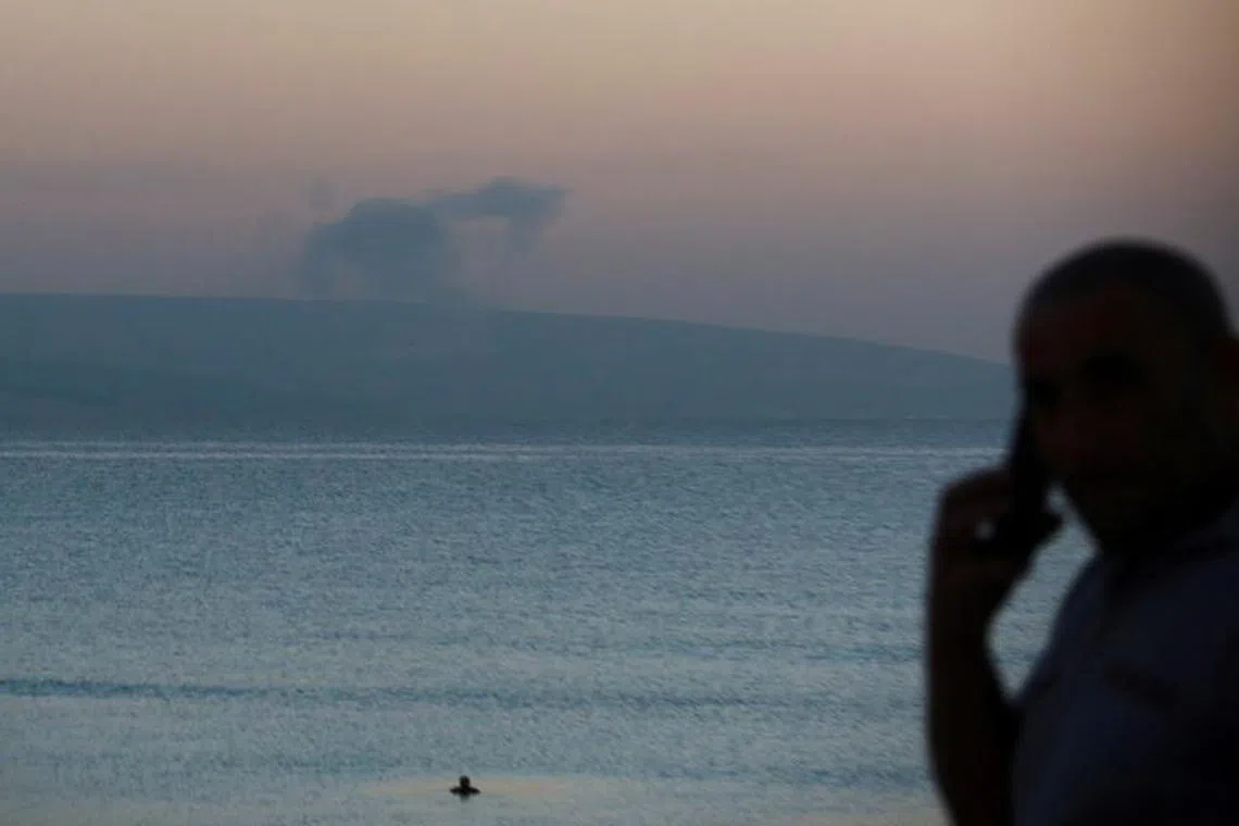 FILE PHOTO: Smoke rises on the Lebanese side near the border with Israel, amid ongoing cross-border hostilities between Hezbollah and Israeli forces, as seen from Tyre, southern Lebanon December 2, 2023. REUTERS/Aziz Taher/File Photo