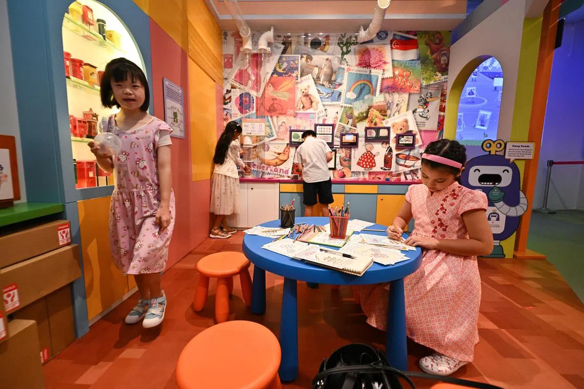 Children playing inside My Neighbourhood gallery of Children's Museum Singapore.
