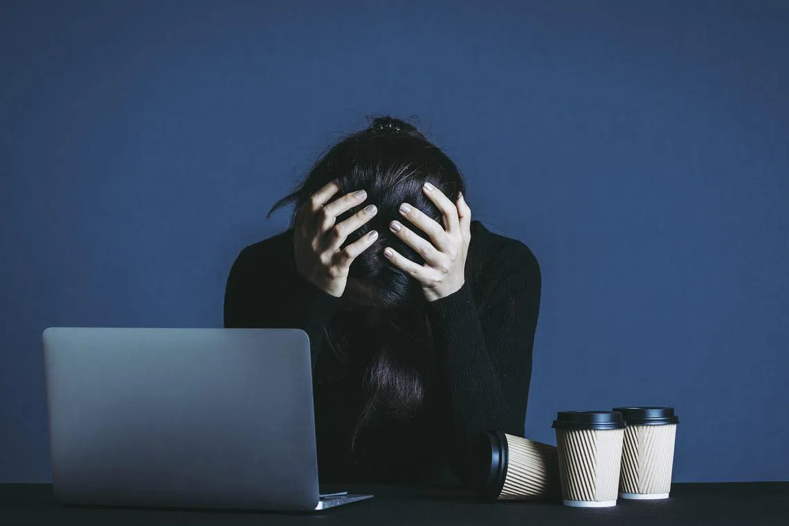 Women are more likely than men to feel overwhelmed at work, a survey by Slack shows. PHOTO: ISTOCKPHOTO