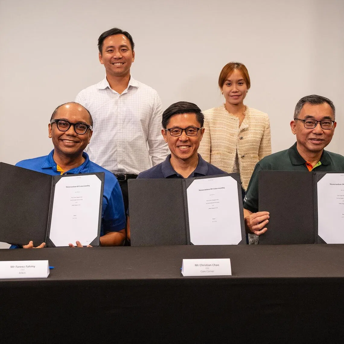 (First row, from left to right) Mr Fareez Fahmy, Chief Executive Officer of Allkin Singapore, Mr Christian Chao, Chief Executive Officer of Care Corner Singapore and Mr Arthur Ling, Chief Executive of Fei Yue Community Service.