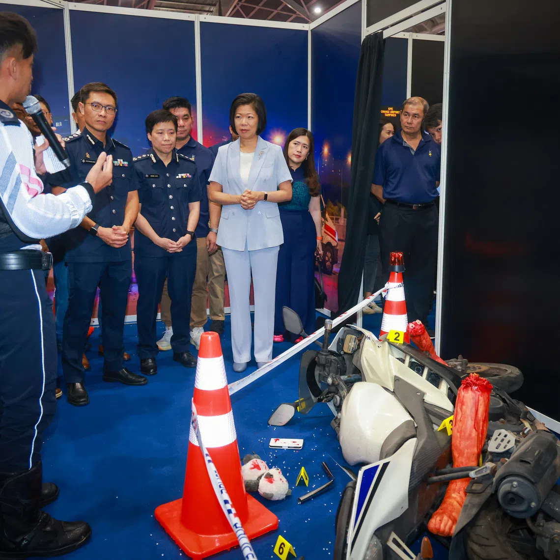 Second Minister for Home Affairs Sim Ann (fourth from left) at the launch of the Singapore Ride Safe campaign at the Singapore Expo on Sept 12.