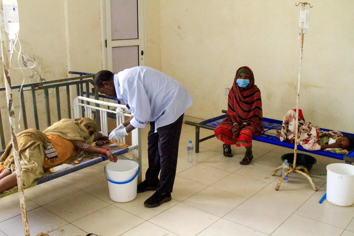 Patients suffering from cholera receive treatment at a rural isolation centre in eastern Sudan.