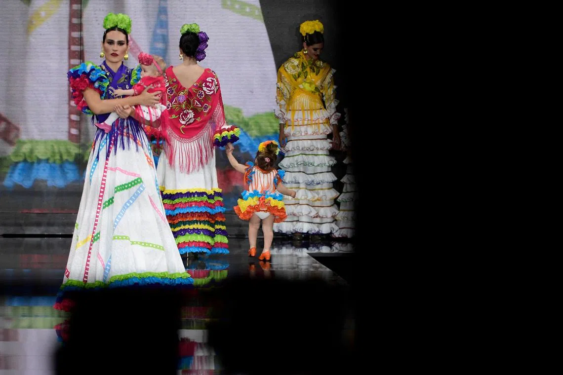Models present creations by Hermanas Serrano during the Simof 2023 (International Flamenco Fashion Show) in Sevilla on Jan 29, 2023. 