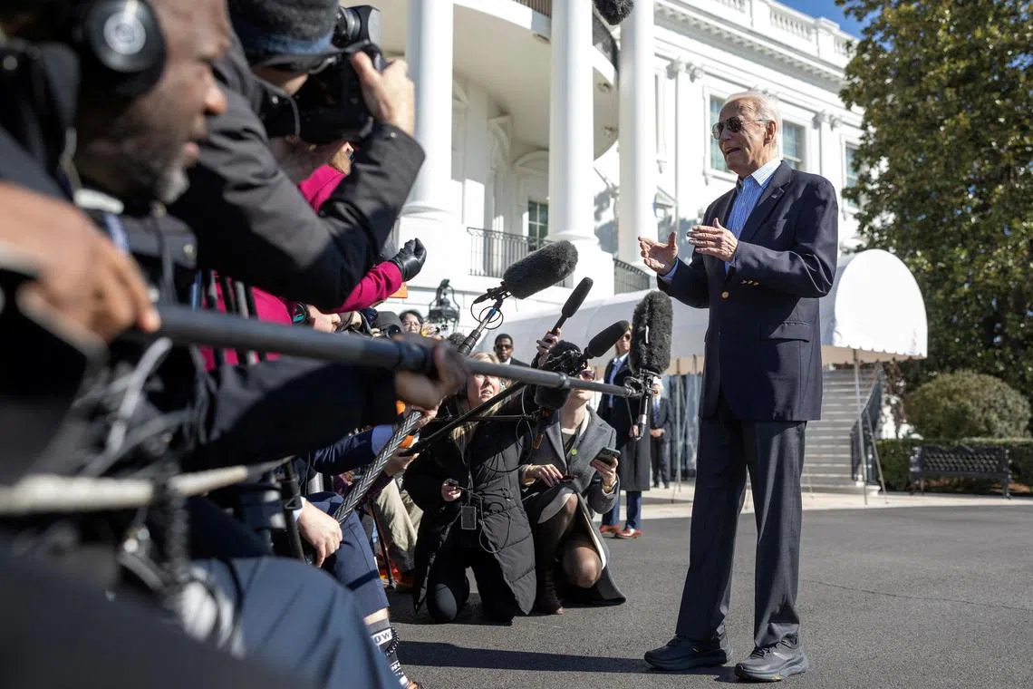 US President Joe Biden speaks to journalists before boarding Marine One at the White House in Washington.