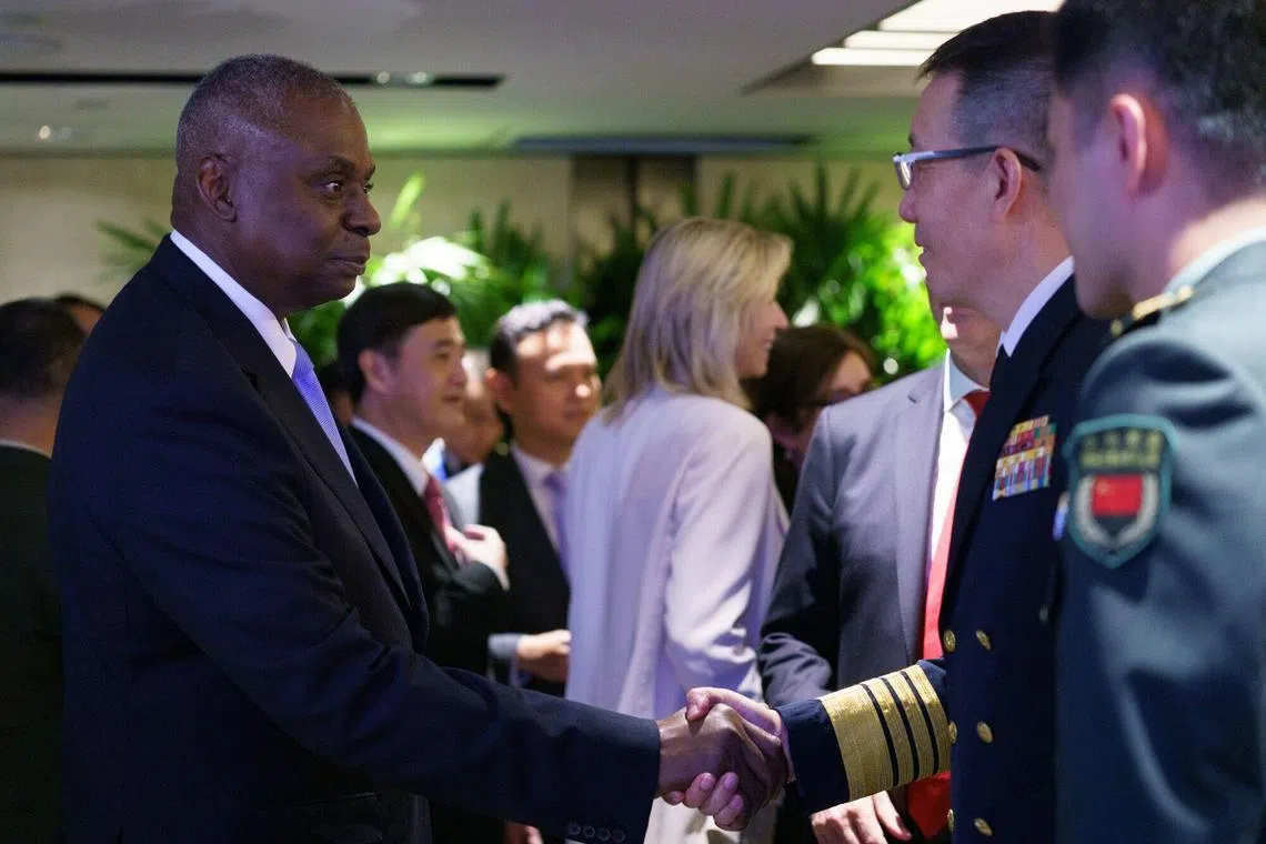 US Defence Secretary Lloyd Austin with his Chinese counterpart Dong Jun at a roundtable discussion at the Shangri-La Dialogue in Singapore on June 1.