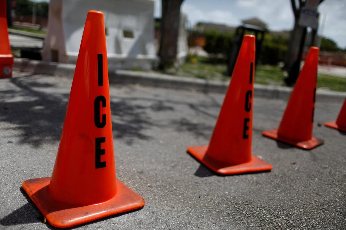 FILE PHOTO: Orange traffic cones with the word \"ICE\" are seen at Immigration and Customs Enforcement (ICE) facilities in Miramar, near Miami, Florida, U.S. July 14, 2019. REUTERS/Marco Bello/File Photo