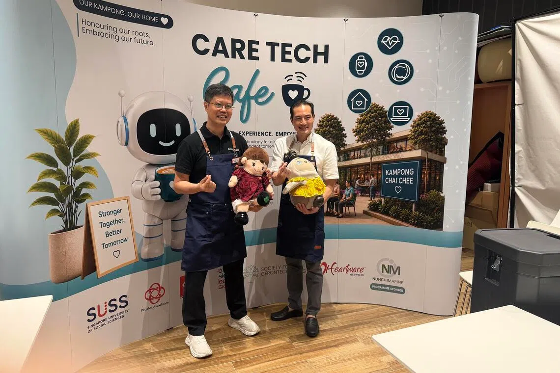 Senior Minister of State for Health Tan Kiat How (right) and SUSS associate professor Kelvin Tan at the Care Tech Cafe at Heartbeat@Bedok on July 31.