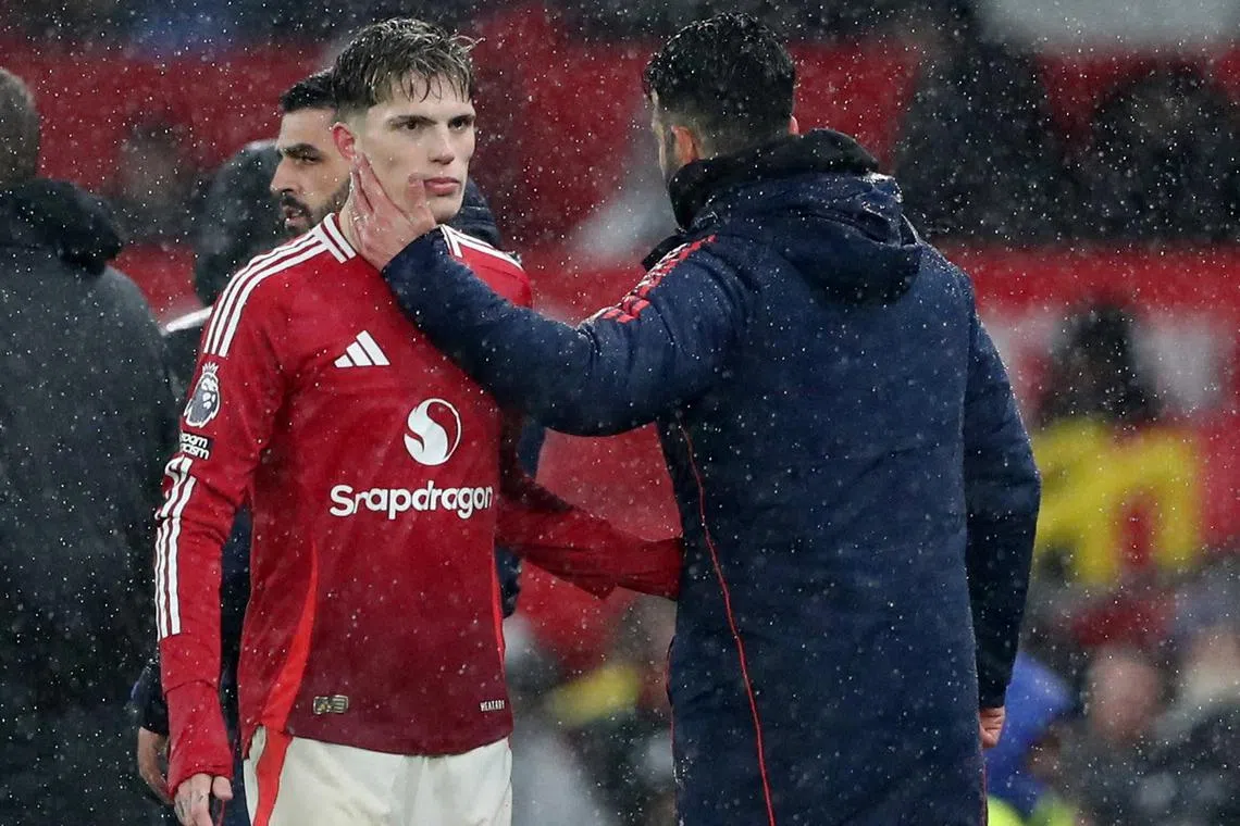 Manchester United's Alejandro Garnacho with Ruben Amorim as he is substituted off.