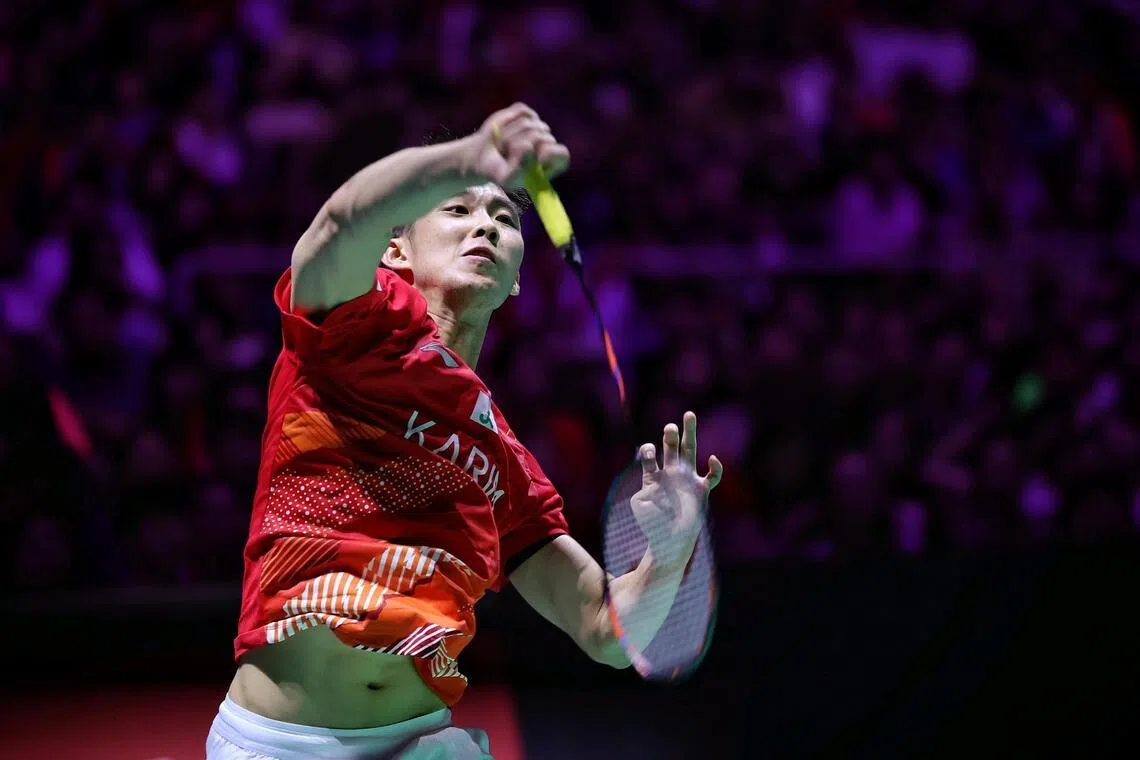 Singapore's Loh Kean Yew in action against France's Alex Lanier in the men's singles final of the KFF Singapore Badminton Open at Singapore Indoor Stadium on May 31.