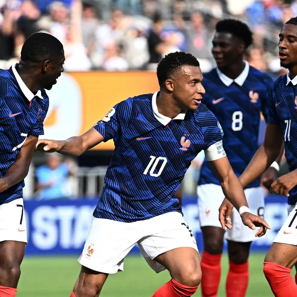 Soccer Football - FIFA World Cup 2026 - Round of 32 - France v Sweden - New York New Jersey Stadium, East Rutherford, New Jersey, U.S. - June 30, 2026 France's Kylian Mbappe celebrates scoring their first goal with Ousmane Dembele and Michael Olise REUTERS/Dylan Martinez