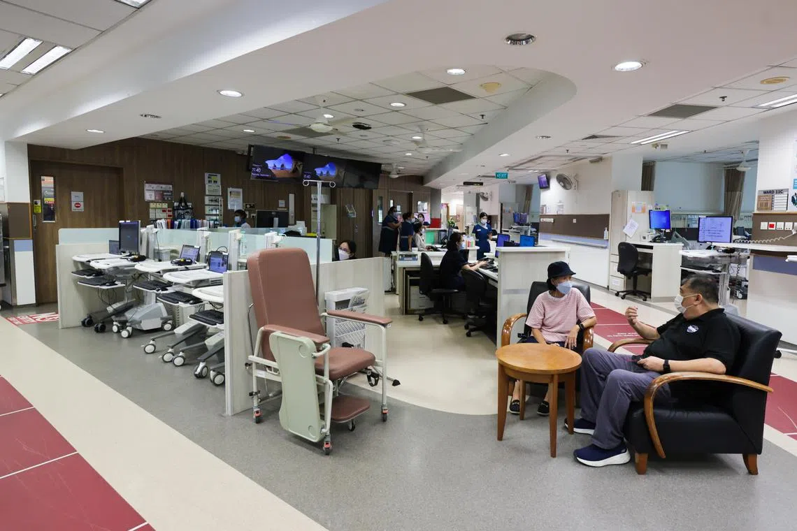 (From left): Mdm Jasmine Chua, 69, homemaker; and Mr Henry Soh, 64, retiree; taking a break at the patient activity corner where patients can engage in reading, light exercises, and social interaction in the new Enhanced Recovery After Surgery (ERAS) ward, on Sep 5, 2024.