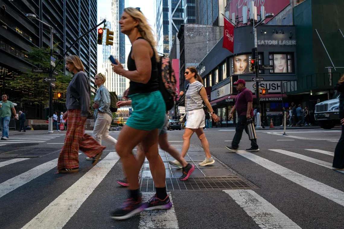 NEW YORK, NEW YORK - OCTOBER 21: People walk in Manhattan on a warm afternoon on October 21, 2024 in New York City. New York City and much of the Northeast are experiencing unusually high temperatures this autumn, with temperatures expected to reach near 80 in Manhattan this afternoon.   Spencer Platt/Getty Images/AFP (Photo by SPENCER PLATT / GETTY IMAGES NORTH AMERICA / Getty Images via AFP)