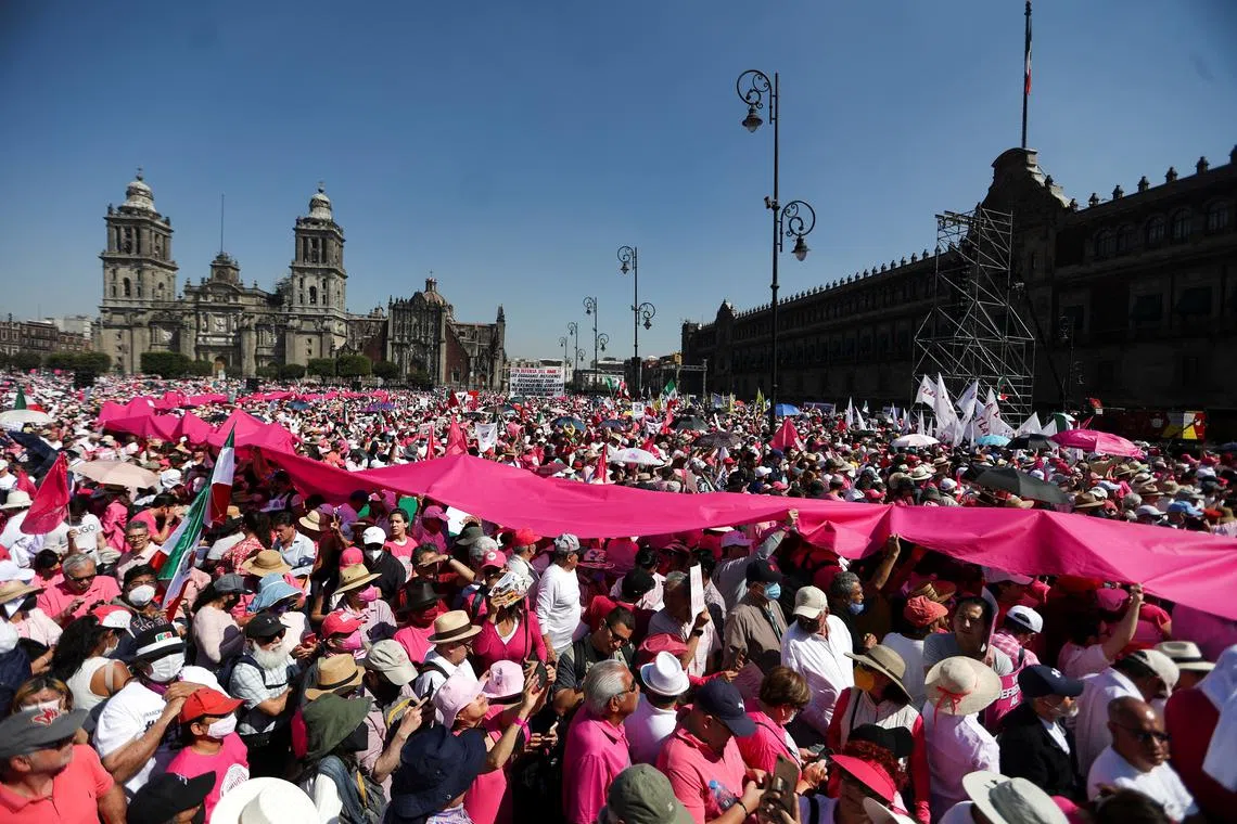 People take part in a protest against President Andres Manuel Lopez Obrador's plan to reform the electoral authority.