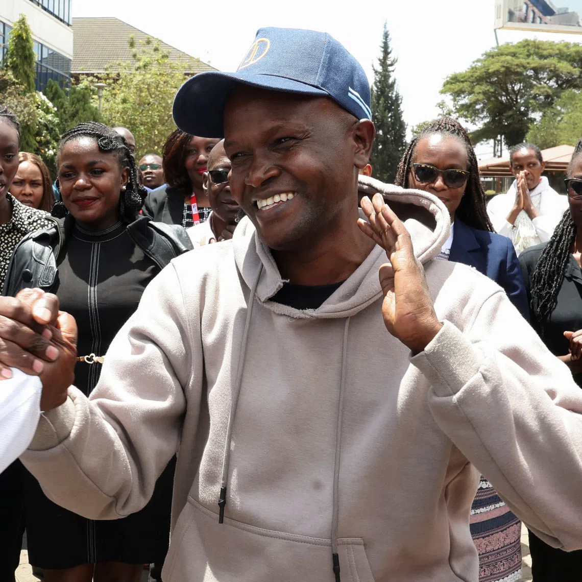 Alex Kiprotich, an associate editor for Standard Group, who was abducted by armed men and released hours later, is welcomed by his colleagues before a press conference on his abduction, at the Standard Group offices in Nairobi, Kenya, September 2, 2026. REUTERS/Monicah Mwangi