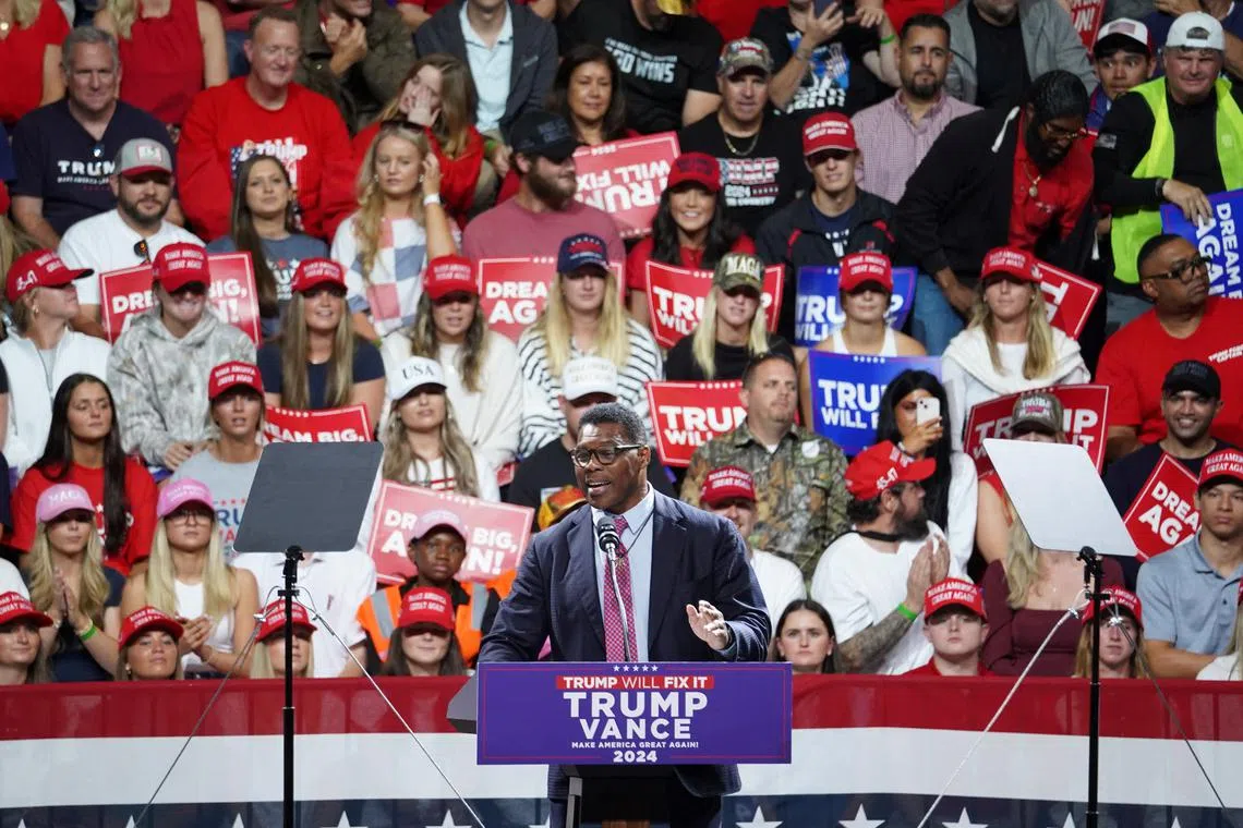 Herschel Walker, former Republican U.S. senate candidate for Georgia, attends a campaign event for Republican presidential nominee and former U.S. President Donald Trump in Macon, Georgia U.S., November 3, 2024. REUTERS/Megan Varner/ File Photo