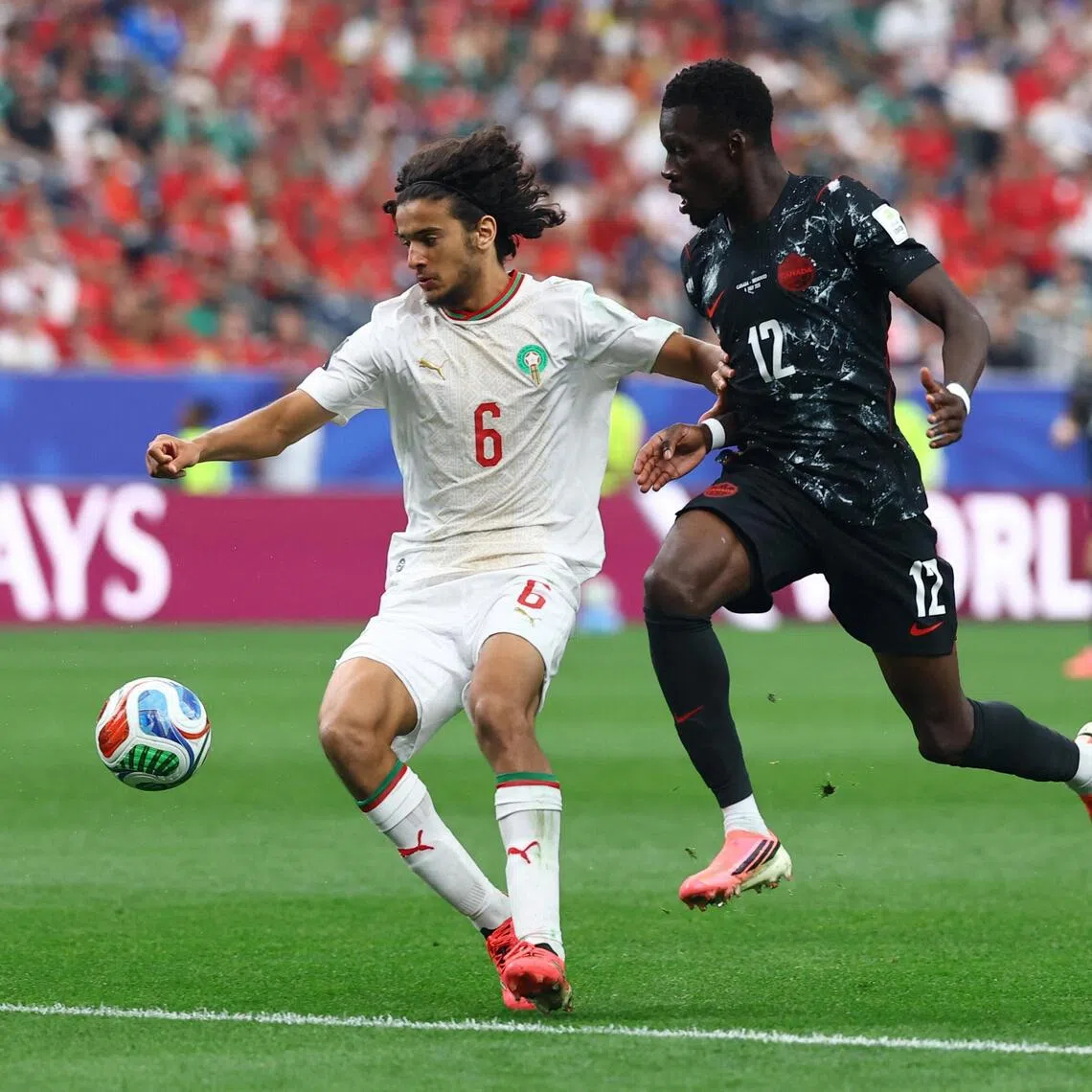 Morocco’s Ayyoub Bouaddi (left) in action with Canada’s Tani Oluwaseyi during a World Cup last-16 clash at NRG Stadium in Houston on July 4.