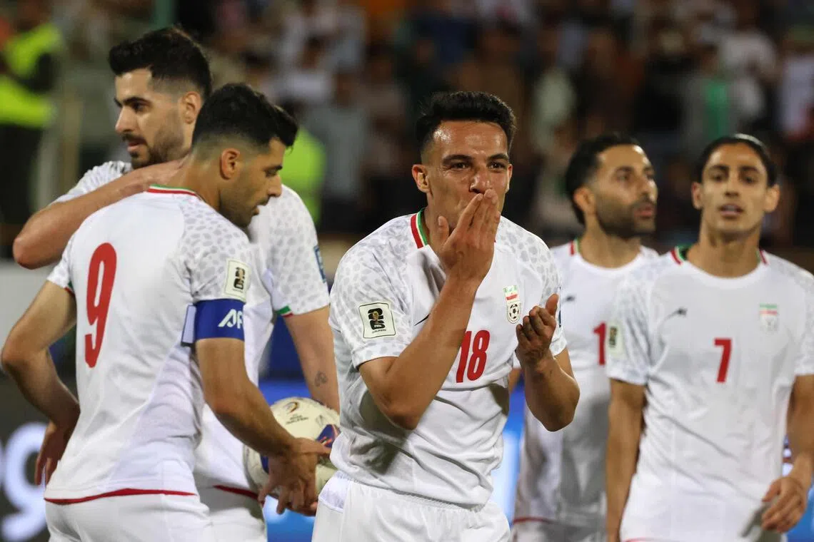 Iran midfielder Amirhossein Hosseinzadeh celebrates scoring his team's third goal during the 3-0 2026 World Cup qualifiying win over North Korea at the Azadi Sports Complex in Tehran on June 10, 2025. 