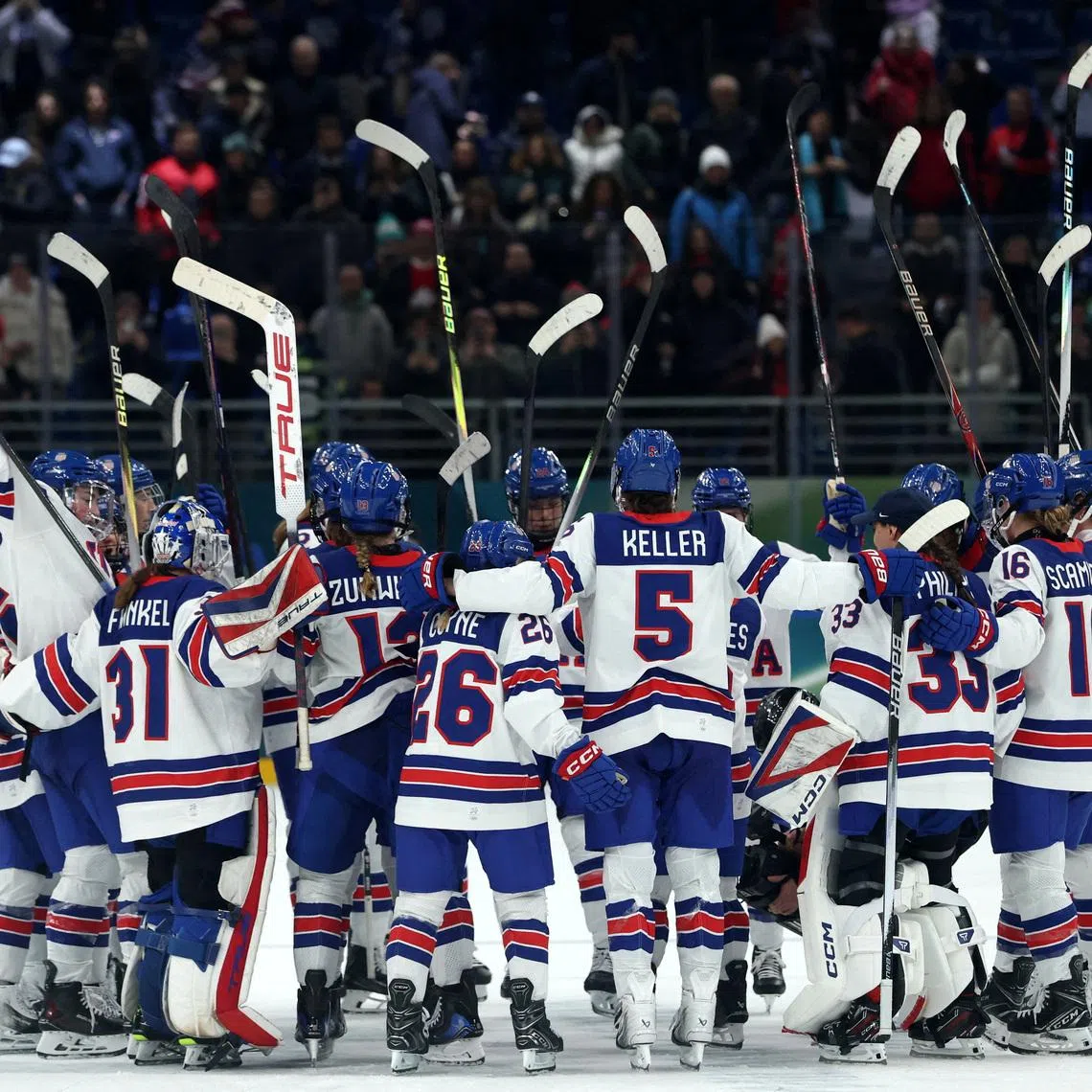 Milano Cortina 2026 Olympics - Ice Hockey - Women's Preliminary Round - Group A - Canada vs United States - Milano Santagiulia Ice Hockey Arena, Milan, Italy - February 10, 2026. United States players celebrate after the match REUTERS/Mike Segar