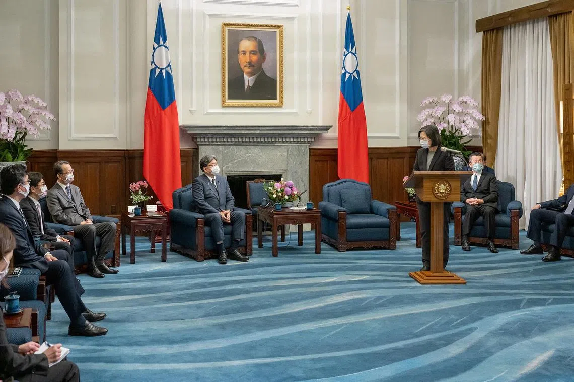 Taiwan President Tsai Ing-wen speaks to Koichi Hagiuda, policy chief for Japan's Liberal Democratic Party (LDP), during their meeting in Taipei, Taiwan December 10, 2022. Taiwan Presidential Office/Handout via REUTERS   