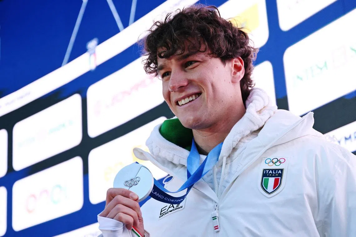 Milano Cortina 2026 Winter Olympics - Alpine Skiing - Interview with Giovanni Franzoni - Livigno, Italy - February 12, 2026  Giovanni Franzoni of Italy poses for a photograph with his silver medal. REUTERS/Angelika Warmuth