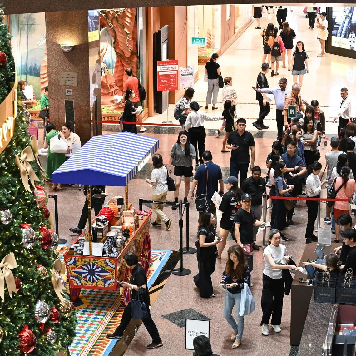 Shoppers at Takashimaya Department Store in Ngee Ann City on Nov 28 queueing for Black Friday promotions that include the Claw & Win lucky draw, with prizes such as iPhones and watches.