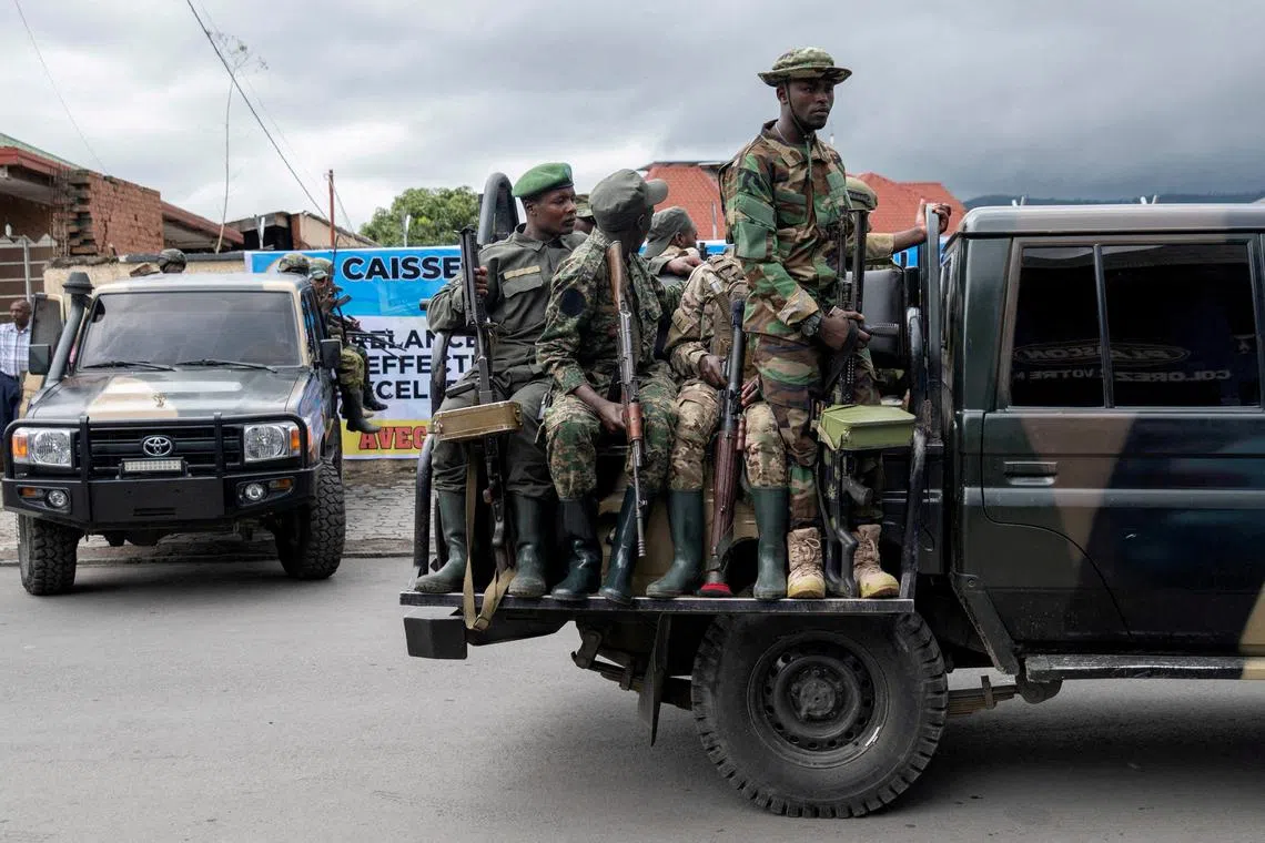 FILE PHOTO: Members of the M23 rebel group mount their vehicles after the opening ceremony of Caisse Generale d'epargne du Congo in Goma, North Kivu province in the East of the Democratic Republic of Congo, April 7, 2025. REUTERS/Arlette Bashizi/File Photo