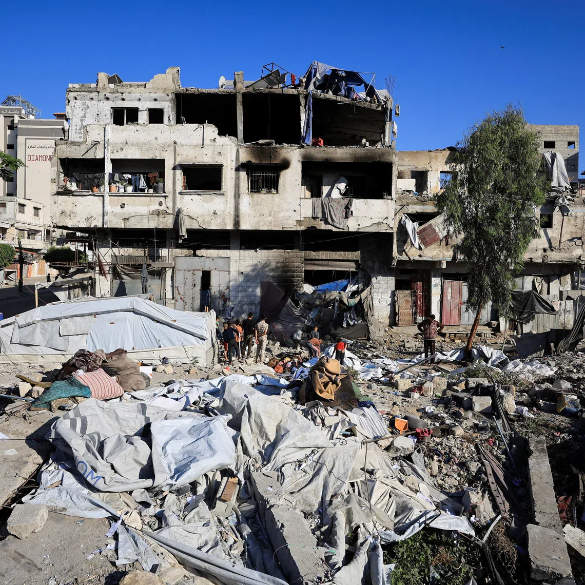 Palestinians inspect the damage at the site of an Israeli strike on Wednesday in Gaza City, May 28, 2026. REUTERS/Dawoud Abu Alkas