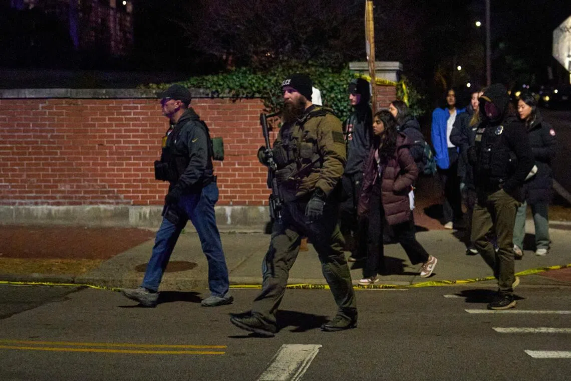 The shooting at Brown University brought hundreds of police officers in helmets and armour to campus.
