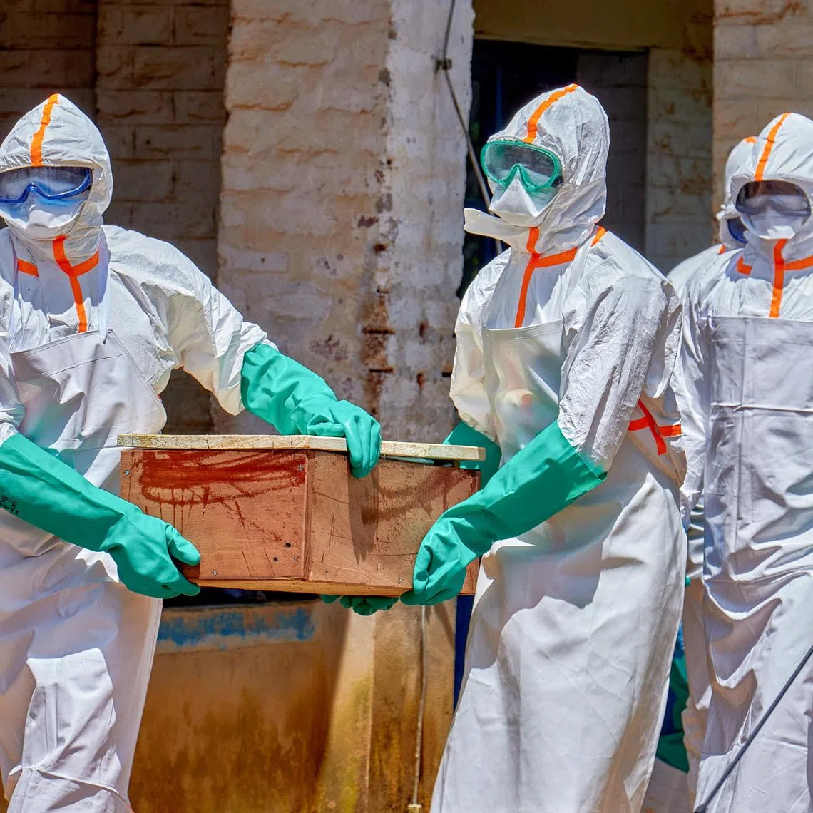 Red Cross workers carry a coffin of a child who died of Ebola in Mongbwalu, Ituri province, the epicentre of the current Ebola outbreak, on May 24.