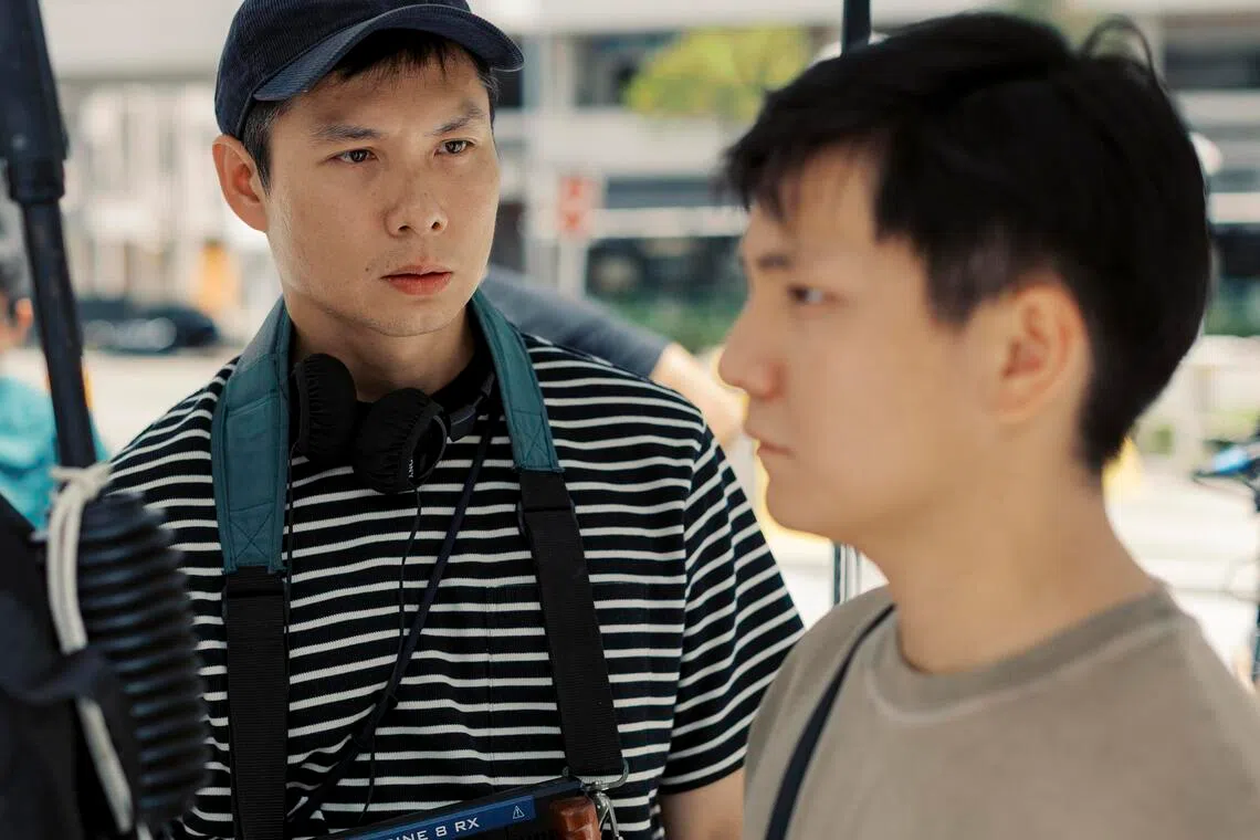 Singaporean film-maker Anthony Chen (left) with actor Koh Jia Ler on the set of his new movie We Are All Strangers.