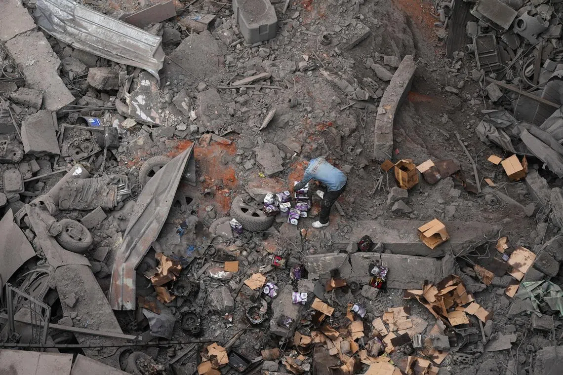 A man inspects the site of an Israeli strike in the southern suburbs of Beirut, Lebanon, April 9, 2026.