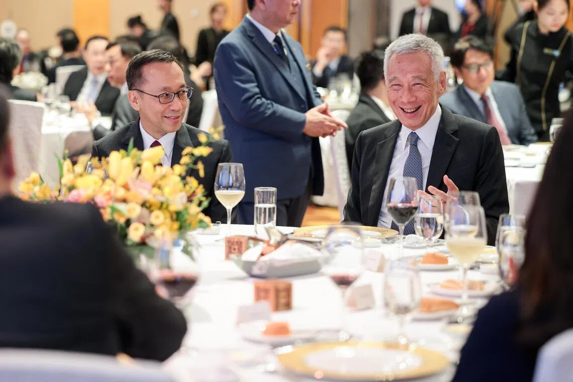 Senior Minister Lee Hsien Loong with Mr Chan Heng Kee, head of civil service, at the Administrative Service dinner held at the Marina Bay Sands Expo and Convention Centre on April 21.