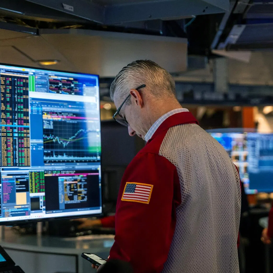 Traders working on the floor of the New York Stock Exchange, in New York City, on Nov 18. 