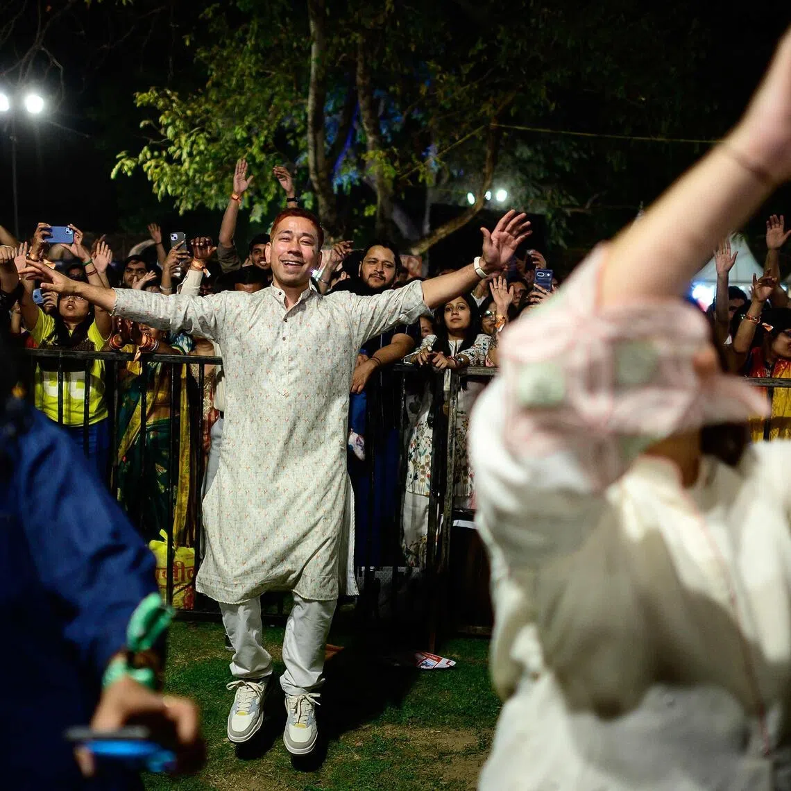 Revellers enjoy Hindu spiritual songs called Bhajans during the Sanatan Journey devotional music festival at the iconic Purana Qila in New Delhi on March 1, 2026.