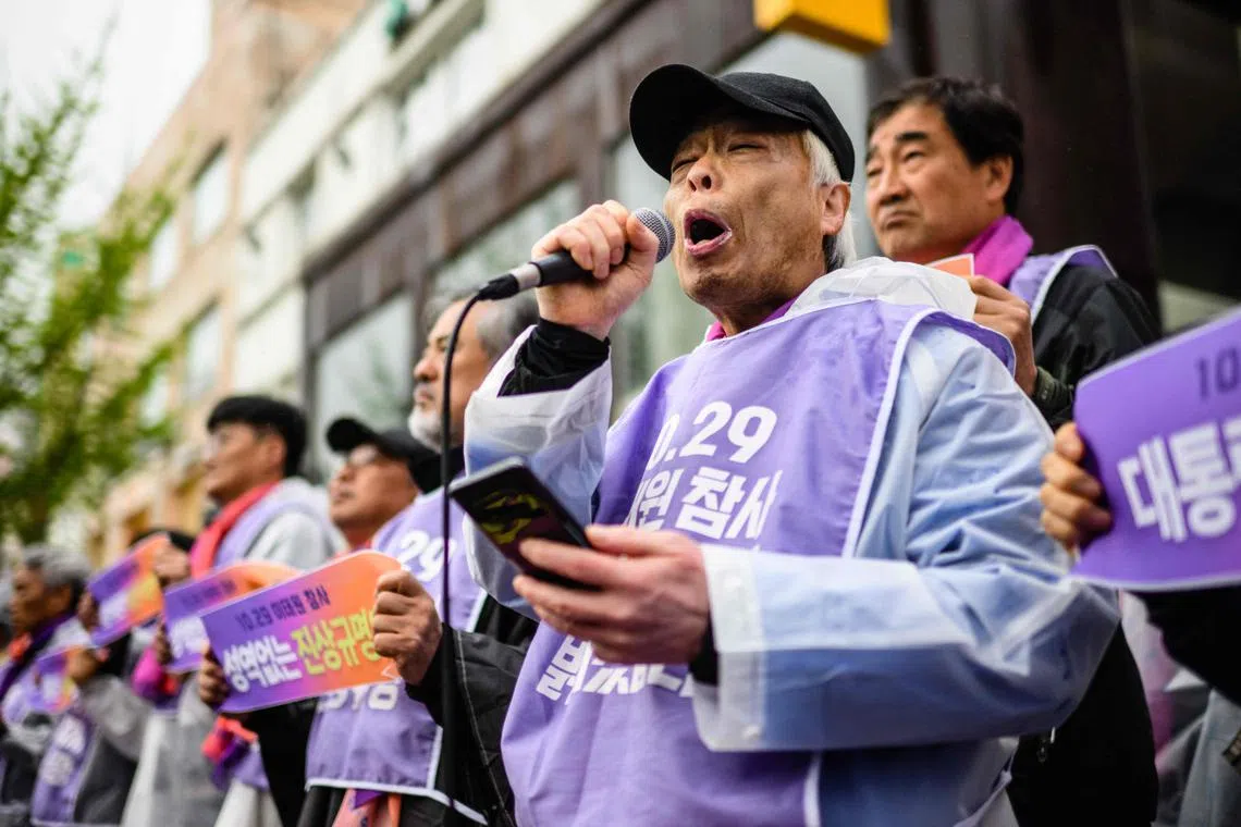 Mr Lee Jong-chul (with microphone attending a rally with other families of victims and supporters near the alleyway where the disaster took place in the popular Itaewon district of Seoul on April 5.