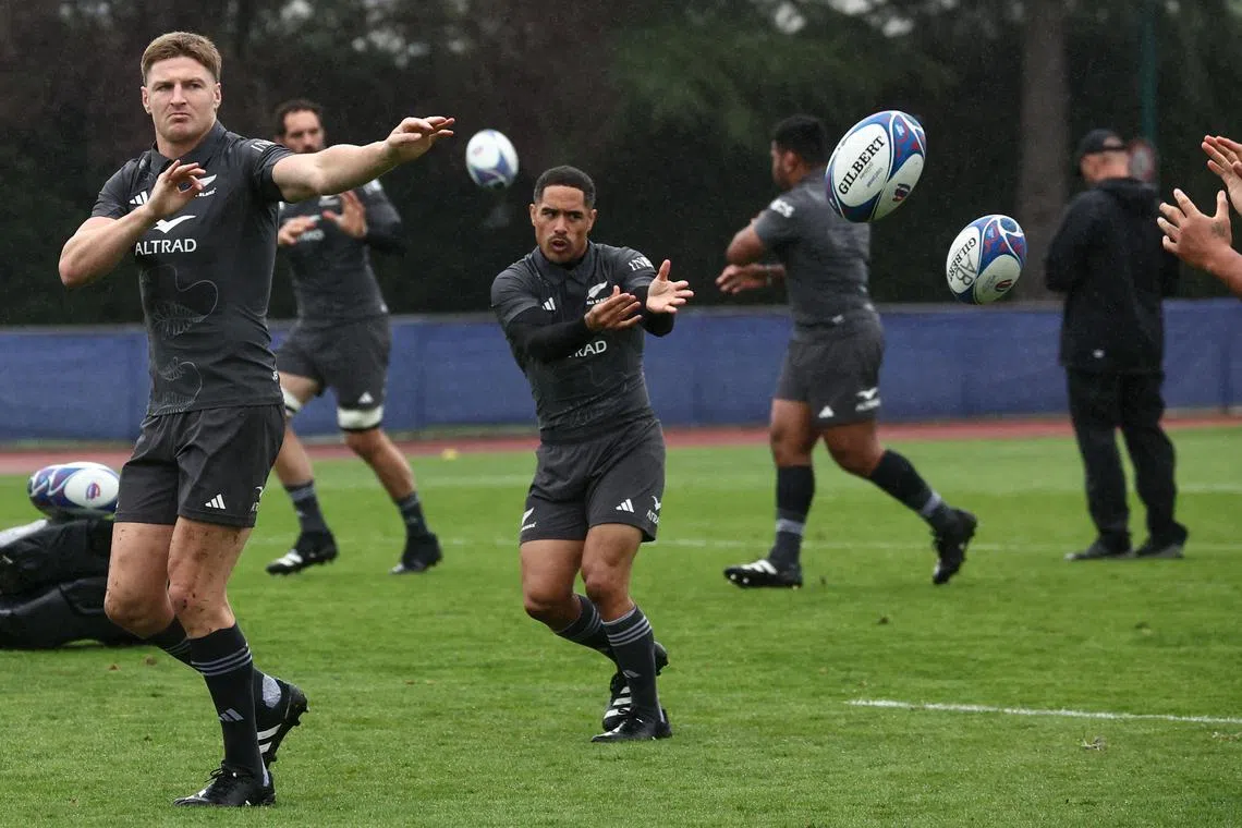 New Zealand's inside centre Jordie Barrett (left) and scrum-half Aaron Smith (centre) during a training session at the Omnisport Croissy Stadium, in Croissy-sur-Seine, western Paris.