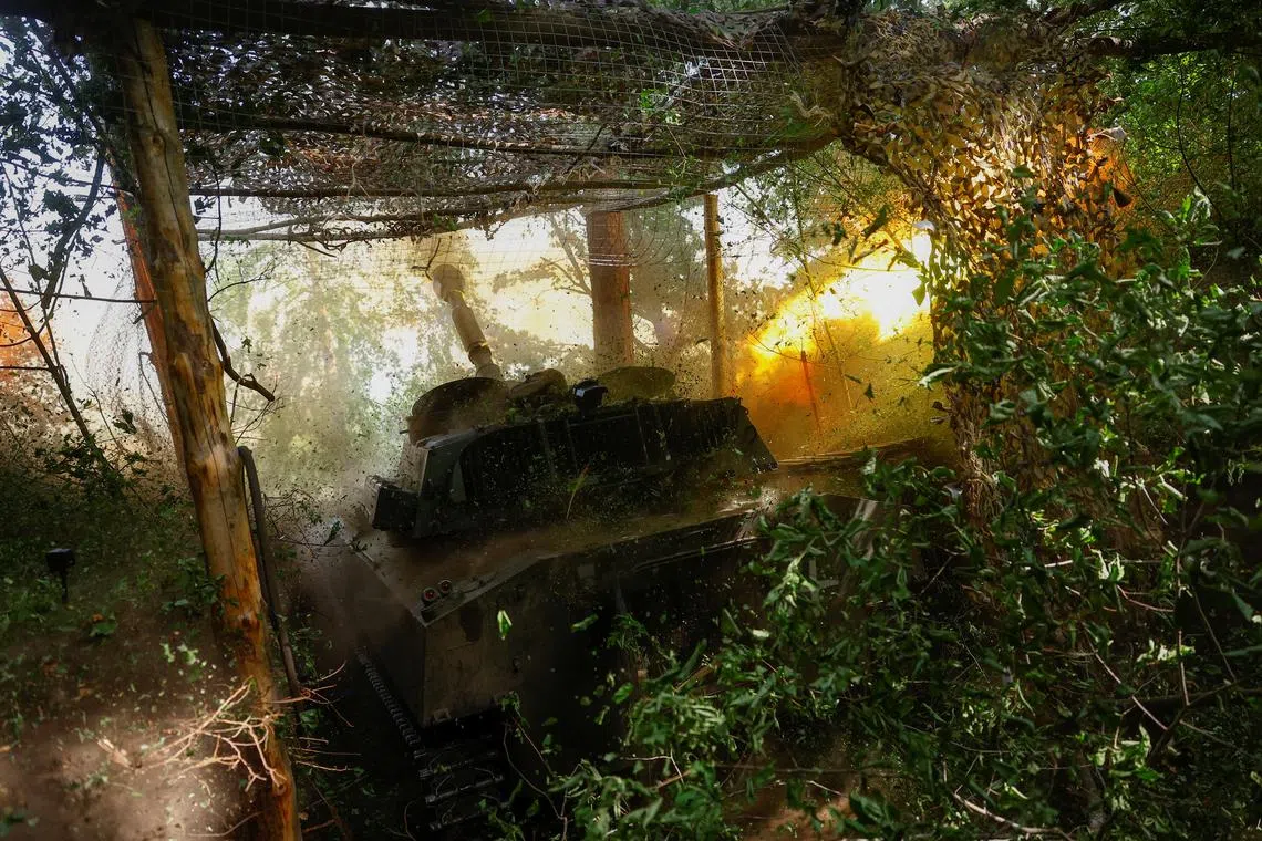 Ukrainian servicemen of the 42nd Separate Mechanized Brigade fire a 2S1 Gvozdika self-propelled howitzer towards Russian troops in a front line, amid Russia's attack on Ukraine, in Kharkiv region, Ukraine May 16, 2024. REUTERS/Valentyn Ogirenko