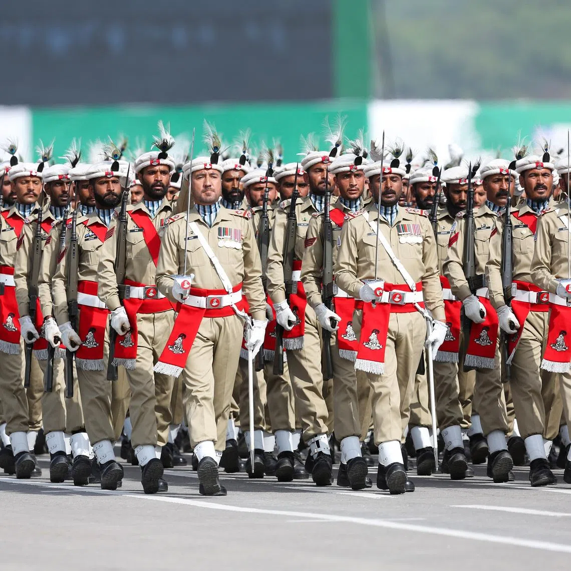 FILE PHOTO: Soldiers from the Pakistani Northern Light Infantry regiment march during the Pakistan Day military parade in Islamabad, Pakistan, March 23, 2022. REUTERS/Saiyna Bashir/File Photo