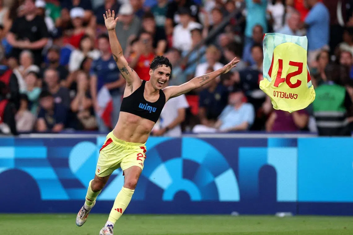 Spain's Sergio Camello celebrates scoring their fifth goal. 