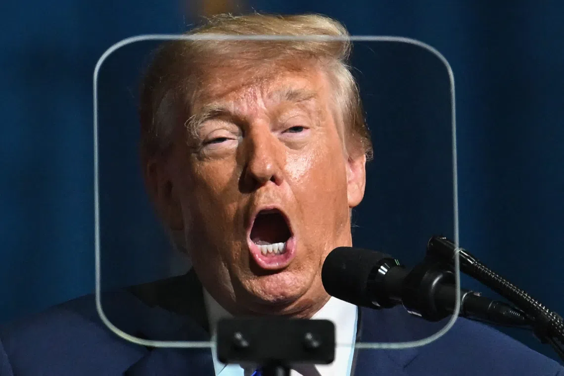 TOPSHOT - US President Donald Trump is seen through a teleprompter as he speaks at a midterm campaign rally at the Rock Hill Sports & Event Center in Rock Hill, South Carolina on October 29, 2026. (Photo by Kent NISHIMURA / AFP)