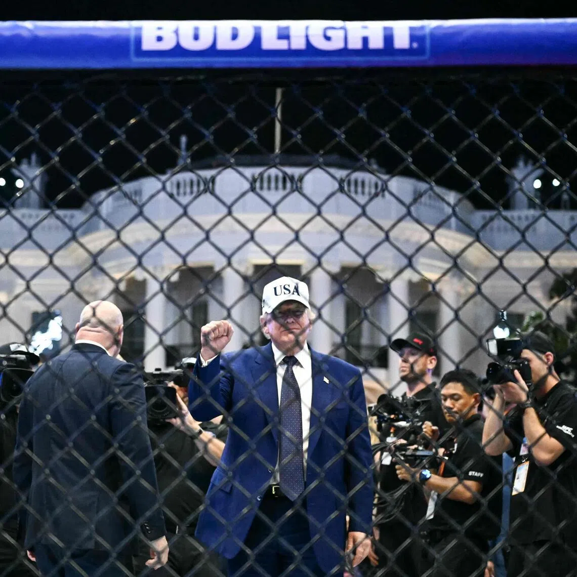 US President Donald Trump standing in The Octagon at the conclusion of the “UFC Freedom 250” mixed martial arts event, on the South Lawn of the White House on June 15.