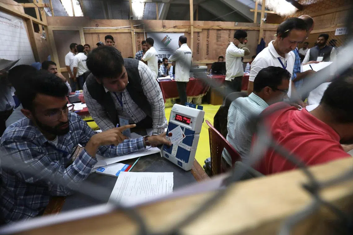epa11648453 Election officials count votes for assembly (local) elections in Srinagar, Kashmir, India, 08 October 2024. The counting for the Jammu and Kashmir Legislative Assembly polls is underway with the fate of 873 candidates contesting on 90 seats hanging in the balance. Any political party or an alliance requires to win 46 seats to win majority in the house. These were the first Jammu and Kashmir Assembly polls held in 10 years and also the first since the abrogation of Article 370 of the Indian constitution that ended the semi-autonomous character of the region on August 5, 2019 and downgrading and division of the Jammu and Kashmir state into federally administered two union territories of J&K and Ladakh.  EPA-EFE/FAROOQ KHAN