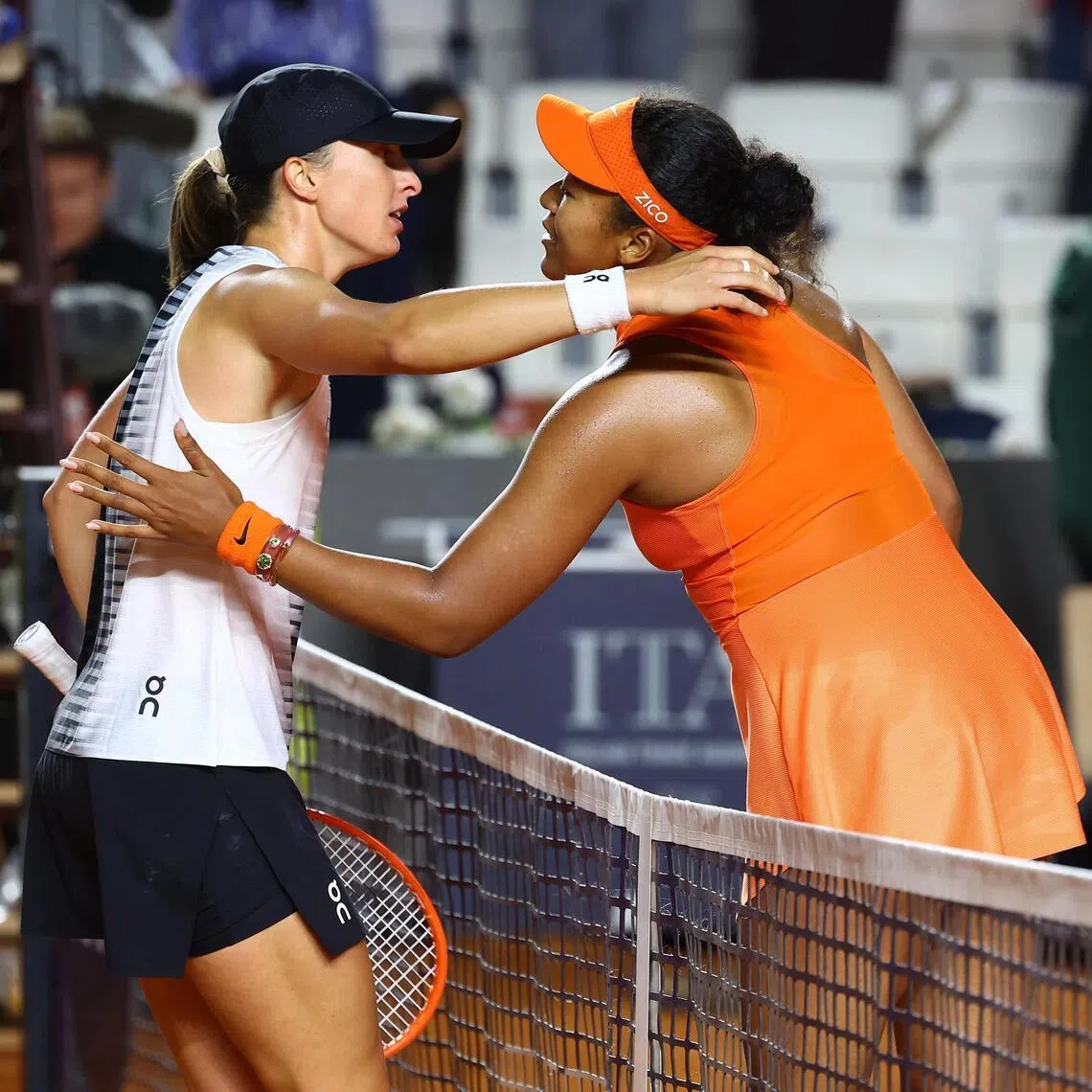 Poland's Iga Swiatek with Japan's Naomi Osaka after winning her round of 16 match at the Italian Open.
