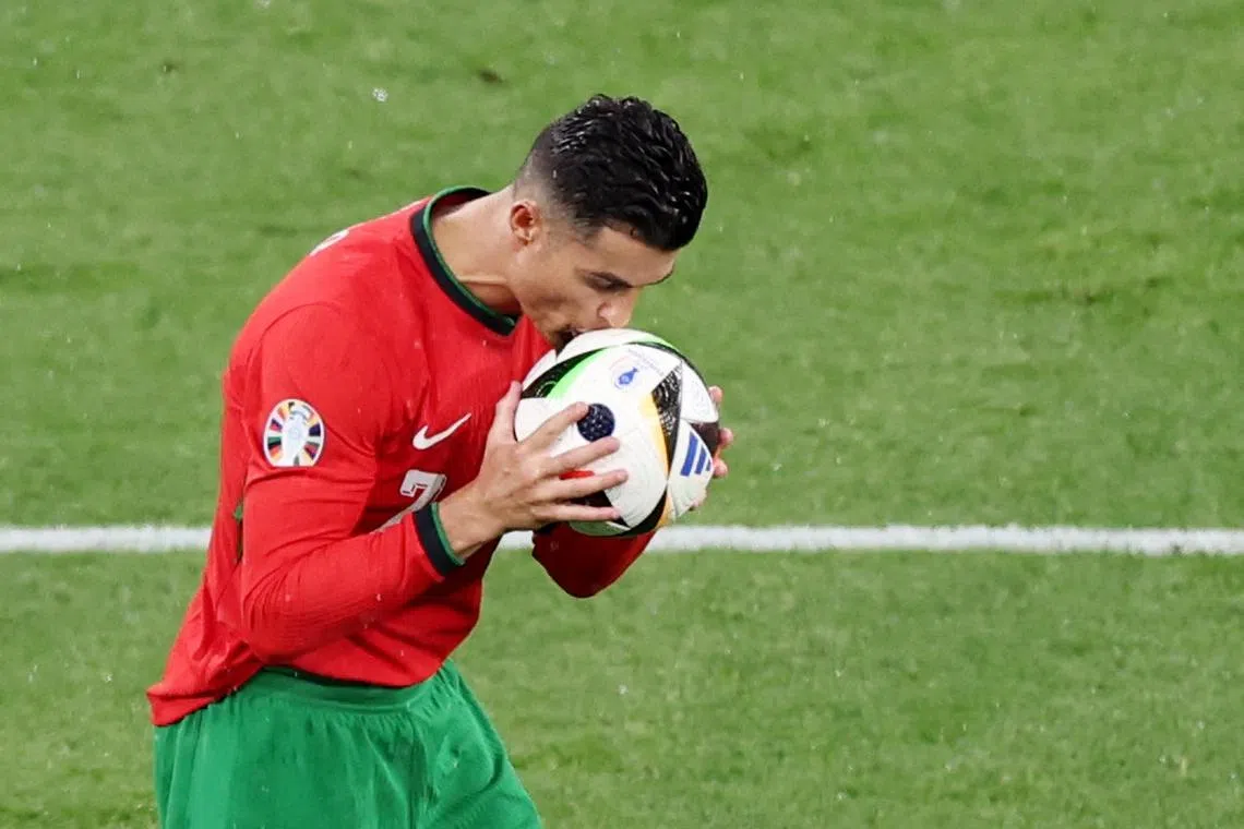 Soccer Football - Euro 2024 - Group F - Portugal v Czech Republic - Leipzig Stadium, Leipzig, Germany - June 18, 2024  Portugal's Cristiano Ronaldo kisses the ball REUTERS/Karina Hessland/File Photo