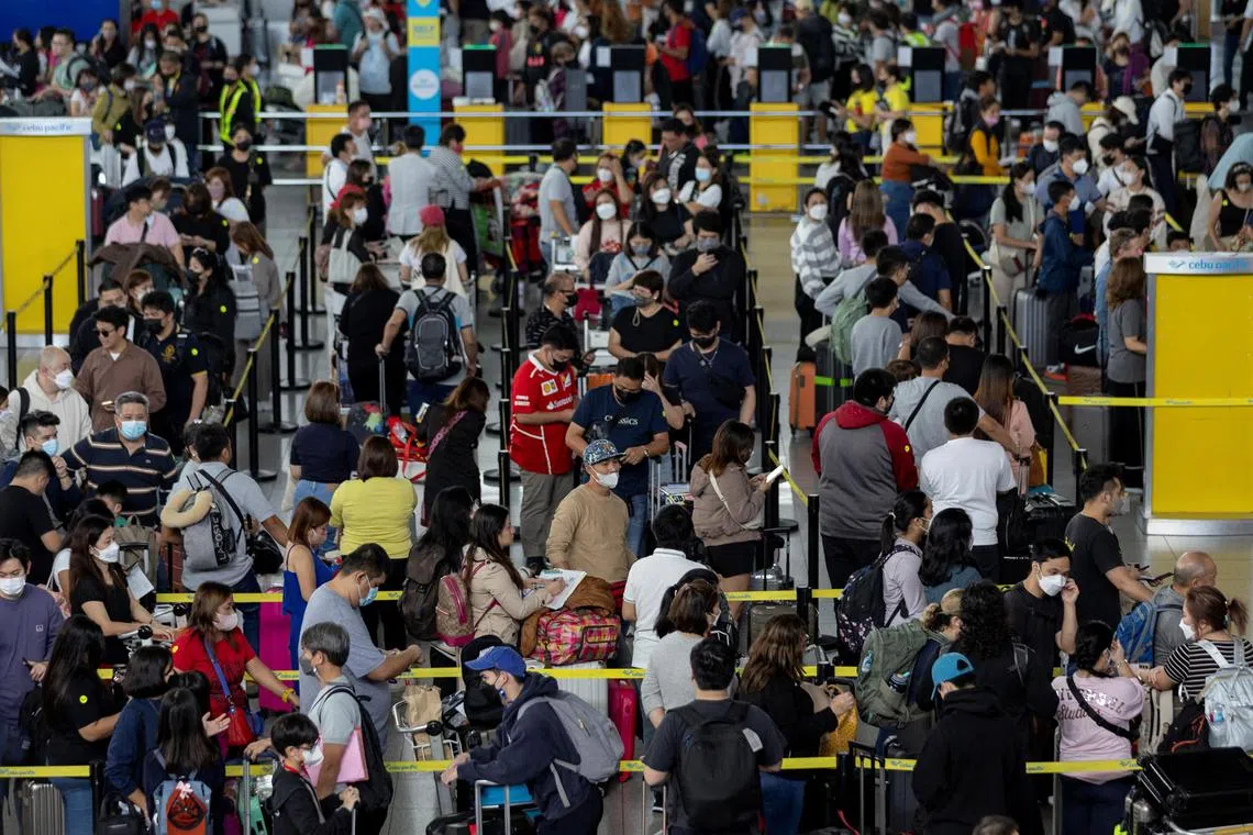 Passengers queueing at Ninoy Aquino International Airport, in Pasay City, Metro Manila, the Philippines, on Jan 2, 2023. 