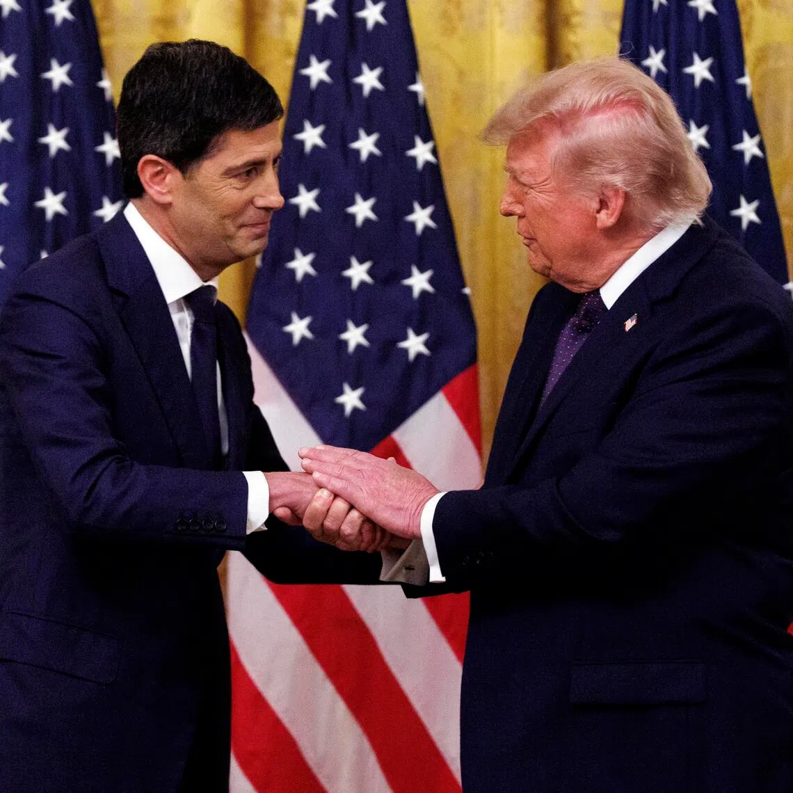 US President Donald Trump (right) shaking hands with Mr Kevin Warsh during the swearing-in of Mr Warsh as the new chairman of the Federal Reserve on May 22 at the White House.