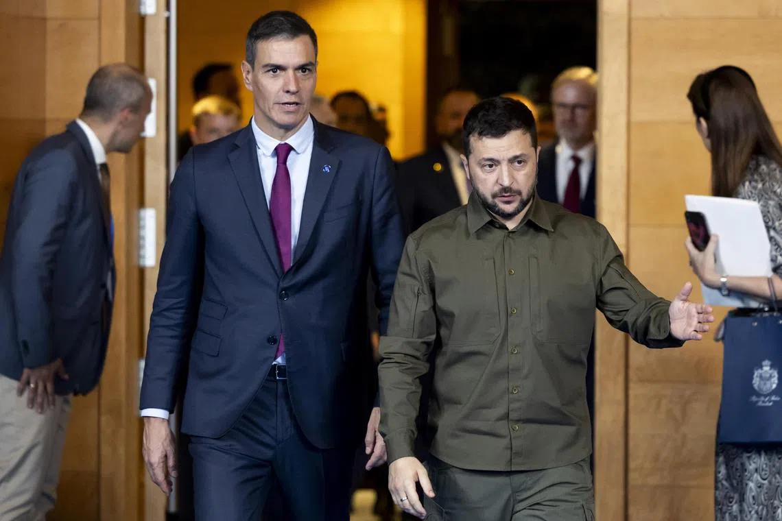 Spain's acting Prime Minister Pedro Sanchez (left) and Ukraine's President Volodymyr Zelensky arrive for the third European Political Community Summit, in Granada, Spain.